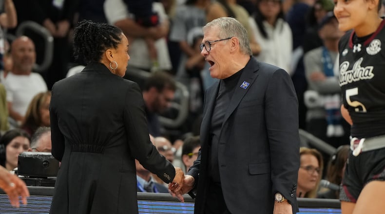 South Carolina head coach Dawn Staley, left, and UConn head coach Geno Auriemma argue after a woman's NCAA college basketball tournament semifinal game at the Final Four, Friday, April 3, 2026, in Phoenix. (AP Photo/Rick Scuteri)