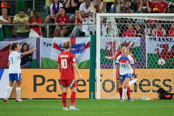 England's Alessia Russo, right, celebrates after scoring her sides fourth goal during the Women's Euro 2025, group D, soccer match between England and Wales at Arena St. Gallen in St. Gallen, Switzerland, Sunday, July 13, 2025. (AP Photo/Martin Meissner)