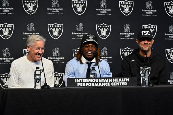 Las Vegas Raiders first-round draft pick Ashton Jeanty, center, speaks as head coach Pete Carroll, left, and general manager John Spytek look on during an NFL football news conference Friday, April 25, 2025, in Henderson, Nev. (AP Photo/David Becker)