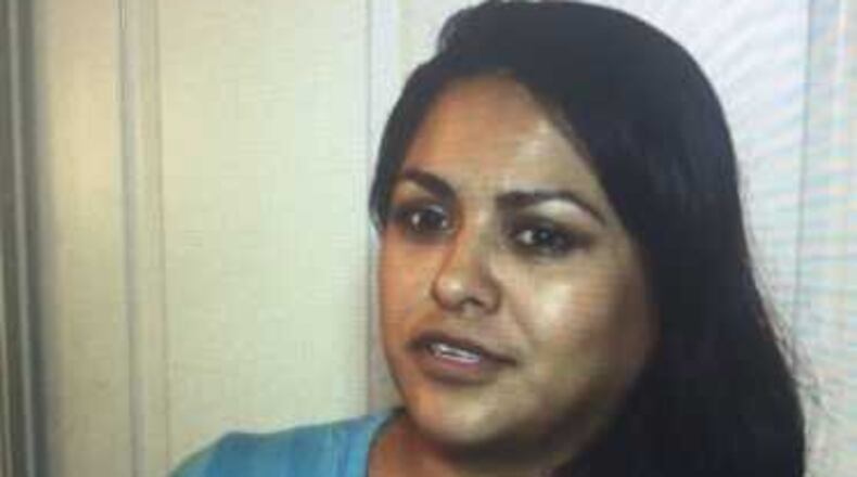 This woman says she was robbed and attacked last week while walking to her apartment in Roswell.