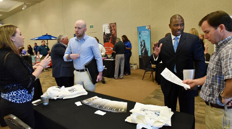 Job seekers at a fair last March in Cumming.