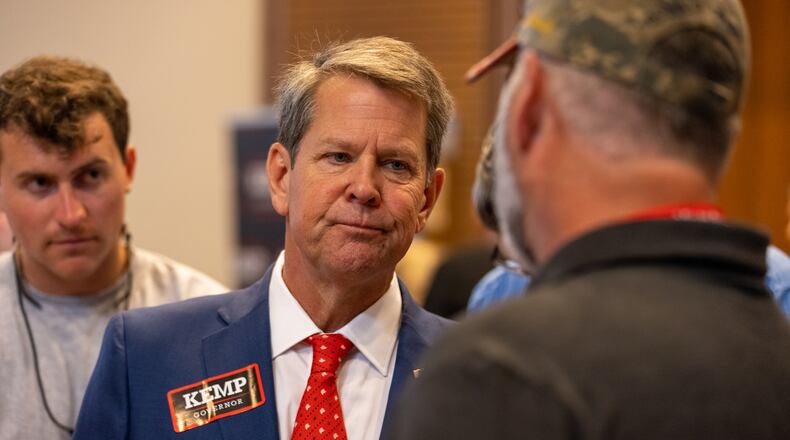 Gov. Brian Kemp faces questioning at the Georgia GOP convention in June in Jekyll Island from supporters of former President Donald Trump who blame him for the president's loss in November. Kemp tried to counter by stressing his own conservative record. Nathan Posner for the Atlanta-Journal-Constitution