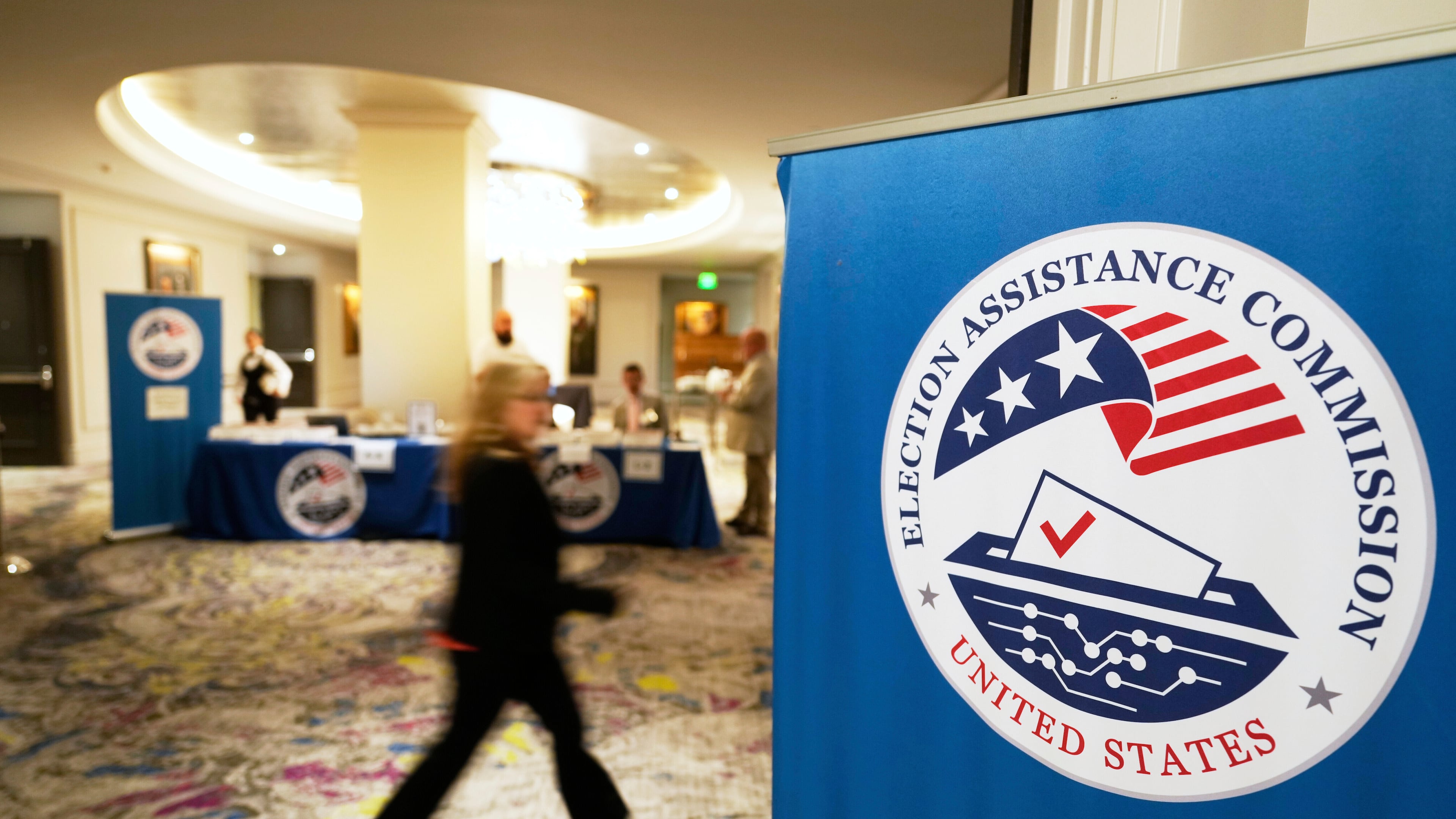 FILE - A person arrives for a U.S. Election Assistance Commission Standards Board public meeting, April 24, 2025, in Charlotte, N.C. (AP Photo/Chris Carlson, File)