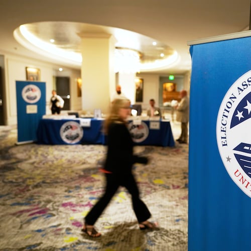FILE - A person arrives for a U.S. Election Assistance Commission Standards Board public meeting, April 24, 2025, in Charlotte, N.C. (AP Photo/Chris Carlson, File)