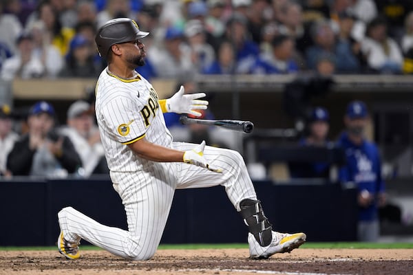 San Diego Padres' Elias Diaz reacts after striking out during the ninth inning of a baseball game against the Los Angeles Dodgers Monday, June 9, 2025, in San Diego. (AP Photo/Orlando Ramirez)