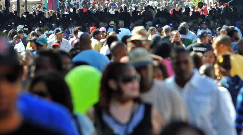 Thousands of people attend the Sweet Auburn Heritage Festival on Historic Auburn Avenue in Atlanta in 2010. Tracking the city's black and white populations over the decades is a trickier task than it sounds. (Hyosub Shin / hshin@ajc.com)