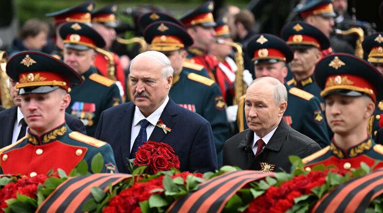 Russian President Vladimir Putin, left,and Belarusian President Alexander Lukashenko, attend a ceremony to lay flowers at the Tomb of the Unknown Soldier by the Kremlin wall inMoscow, Saturday, May 9, 2026, during celebrations of the 81st anniversary of the Soviet Union's victory over Nazi Germany during World War II. (Pelagiya Tikhonova, Sputnik, Kremlin Pool Photo via AP)