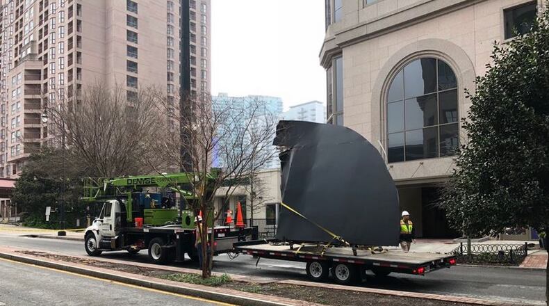 A large piece of metal fell from a building at 14th and West Peachtree streets in Midtown, Atlanta police said.