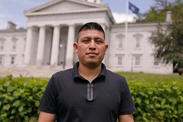 Dairy farmworker José Molina-Aguilar stands outside the Vermont Statehouse after a rally for housing rights for migrant farmworkers in Montpelier, Vt., on Friday, June 13, 2025. (AP Photo/Amanda Swinhart)
