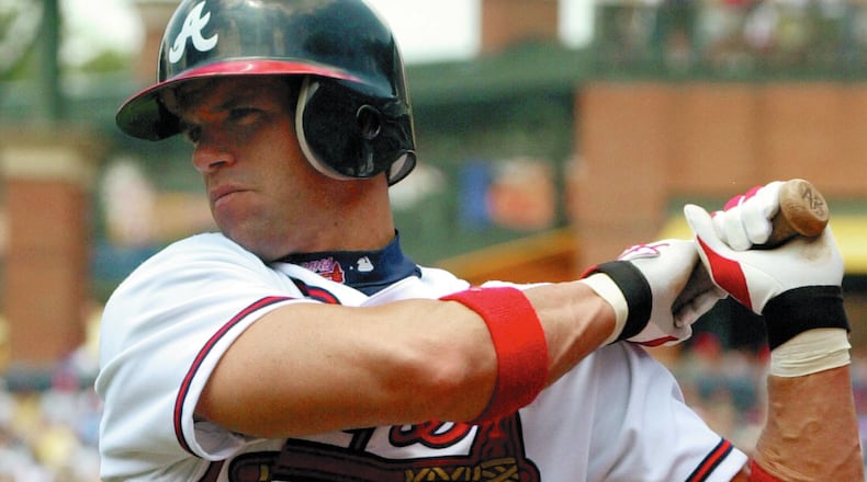 Braves catcher Javy Lopez warms up in the on-deck circle on June 8, 2003. (AP Photo/Ric Feld)