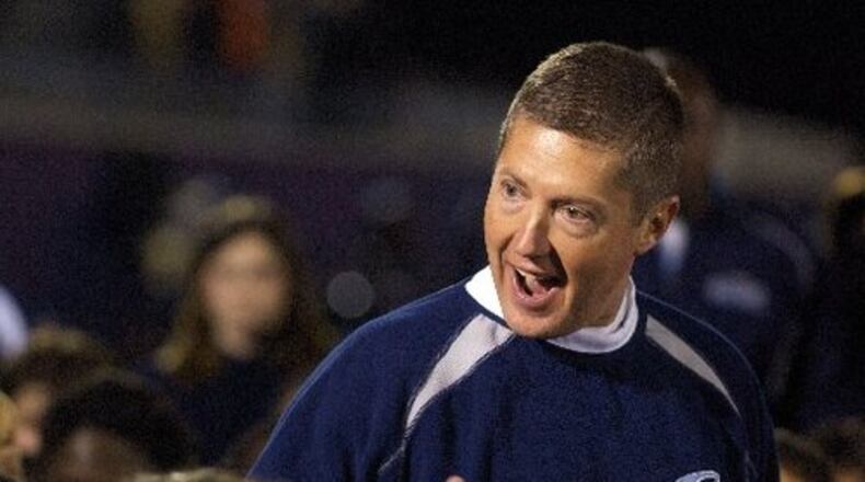 Camden County coach Jeff Herron pumps up his team before kickoff against Northside-Warner Robins Friday night.