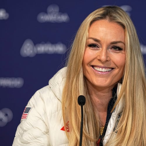 United States' Lindsey Vonn smiles during a press conference by the U.S. ski team at the 2026 Winter Olympics, in Cortina d'Ampezzo, Italy, Tuesday, Feb. 3, 2026. (AP Photo/Fatima Shbair)