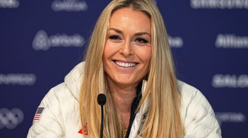 United States' Lindsey Vonn smiles during a press conference by the U.S. ski team at the 2026 Winter Olympics, in Cortina d'Ampezzo, Italy, Tuesday, Feb. 3, 2026. (AP Photo/Fatima Shbair)