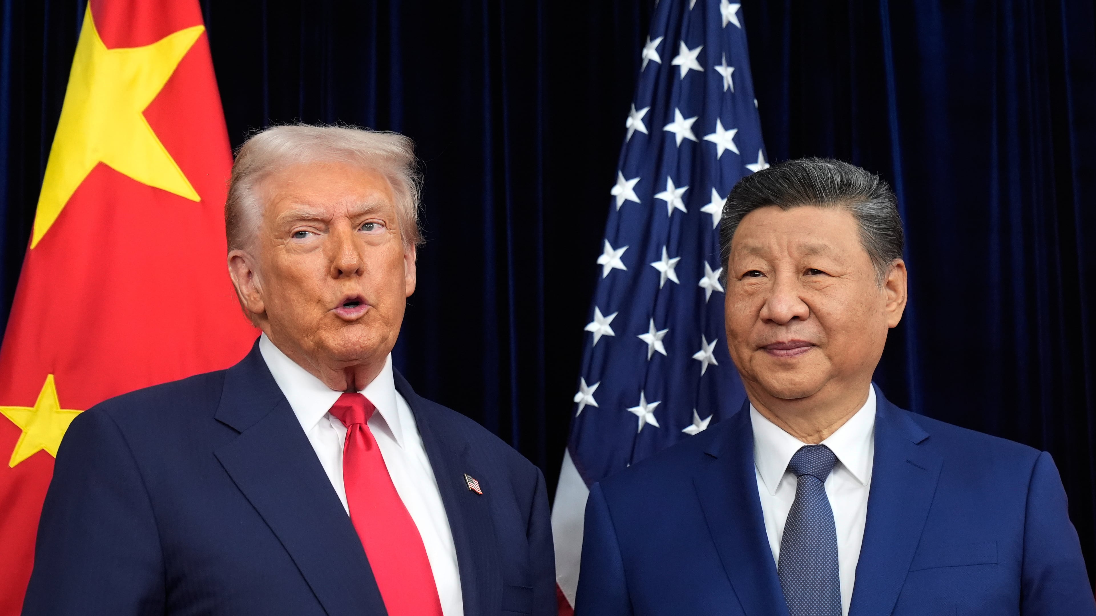 President Donald Trump, left, and Chinese President Xi Jinping pose together ahead of their summit talk at Gimhae International Airport in Busan, South Korea, Thursday, Oct. 30, 2025. (AP Photo/Mark Schiefelbein)
