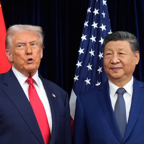 President Donald Trump, left, and Chinese President Xi Jinping pose together ahead of their summit talk at Gimhae International Airport in Busan, South Korea, Thursday, Oct. 30, 2025. (AP Photo/Mark Schiefelbein)