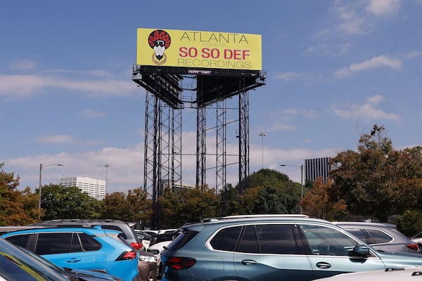 A So So Def billboard rises above an Atlanta parking lot, Monday, Sept. 8, 2025. (Natrice Miller/AJC)