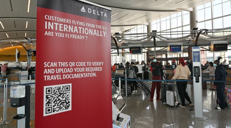 April 29, 2022 Atlanta - International travelers wait in line to checking-in at Delta Air Lines counter in Maynard H. Jackson Jr. International Terminal on Friday, April 29, 2022. (Hyosub Shin / Hyosub.Shin@ajc.com)