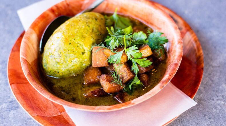 The off-menu mofongo at El Super Pan is served with a green sofrito-based sauce and cubes of pork belly. CONTRIBUTED BY HENRI HOLLIS