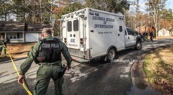 Cobb County police officers and GBI agents were expected to remain in the Mill Chase subdivision throughout the day Thursday to investigate.