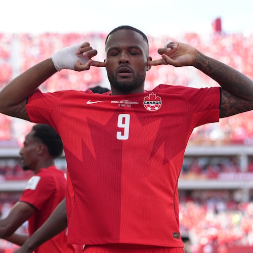 Canada's Cyle Larin (9) celebrates after scoring his sides first goal of the game in the second half of the World Cup Group B soccer match between Canada and Bosnia, Friday, June 12, 2026, in Toronto. ( (AP Photo/Sam Balkansky)