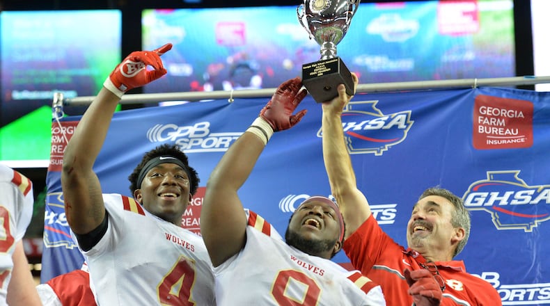 Head coach John Reid (right) led the Rome Wolves to a Class AAAAA state championship in 2016 and 2017. (Hyosub Shin/hshin@ajc.com)