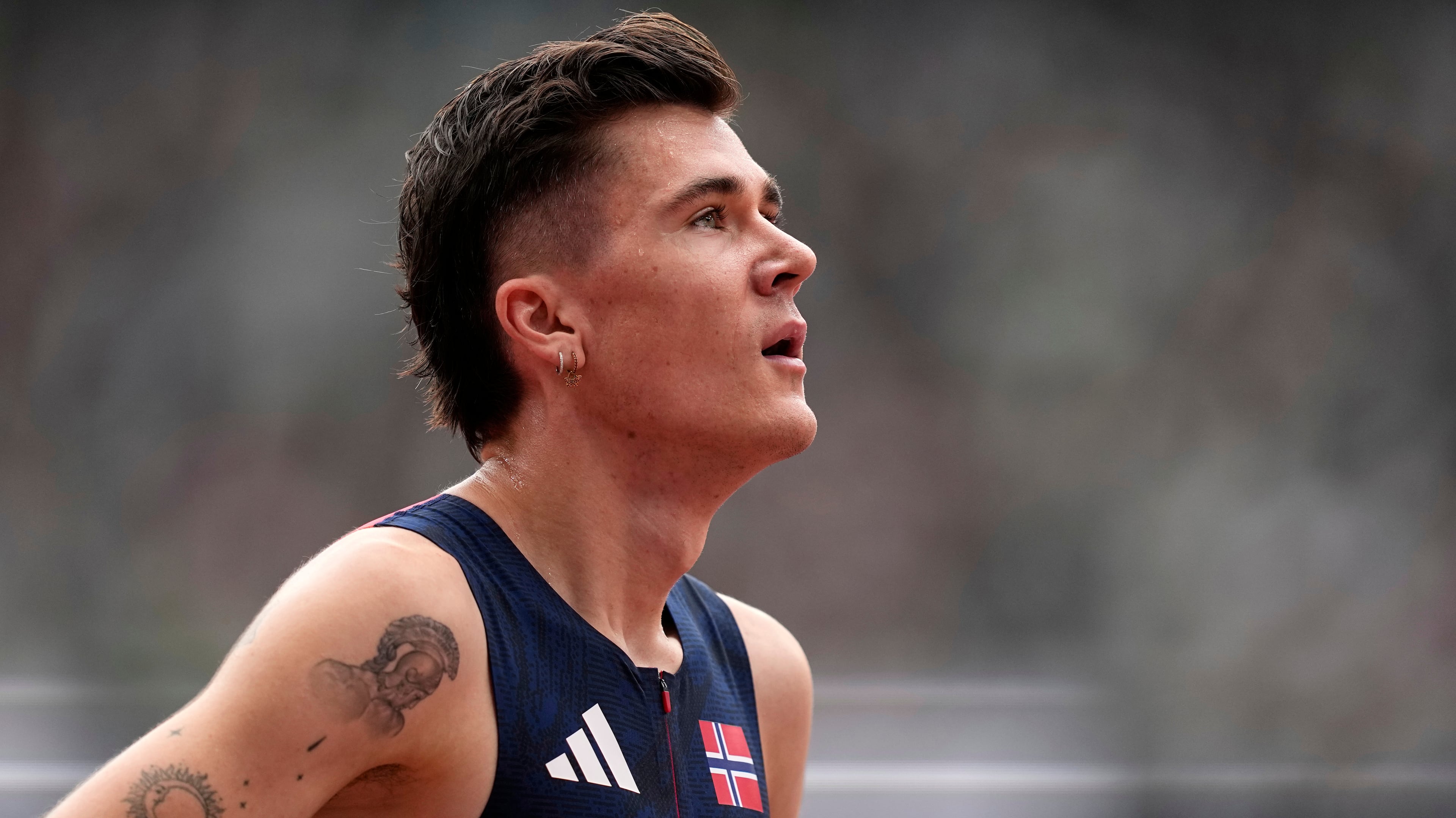 Norway's Jakob Ingebrigtsen reacts after finishing a men's 1,500 meters heat at the World Athletics Championships in Tokyo, Sunday, Sept. 14, 2025. (AP Photo/Petr David Josek)