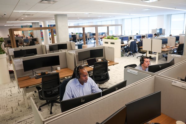 Employees work at the new TriNet office in Dunwoody on Aug. 18, 2026. (Arvin Temkar/AJC)