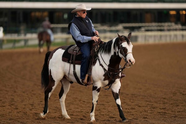 FILE - Trainer D. Wayne Lukas watches a workout at Churchill Downs May 1, 2025, in Louisville, Ky. (AP Photo/Charlie Riedel, File)