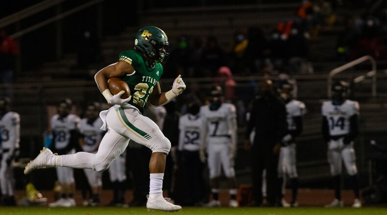 Justice Haynes (22) sophomore running back for Blessed Trinity, sprints to the end zone against Decatur High School during the second-round playoff game Friday, Dec. 4, 2020, in Roswell. Blessed Trinity won 44-0. (Christina Matacotta/For the AJC)