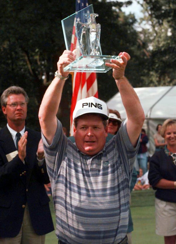 FILE - Ed Fiori of Sugar Land, Texas, holds his trophy after winning the Quad City Classic at the Oakwood Country Club in Coal Valley, Ill., Sunday, Sept. 15, 1996. (AP Photo/Charles Bennett, File)