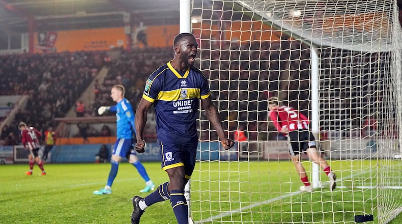 Middlesbrough's Emmanuel Latte Lath celebrates after scoring their third goal of the game with a penalty kick during the Carabao Cup fourth round soccer match against Exeter at St James Park in Exeter, England, Tuesday, Oct. 31, 2023. (Nick Pott/PA via AP)