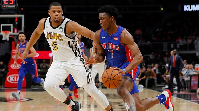 Stanley Johnson of the Detroit Pistons drives against Omari Spellman of the Atlanta Hawks at State Farm Arena on November 9, 2018 in Atlanta, Georgia.