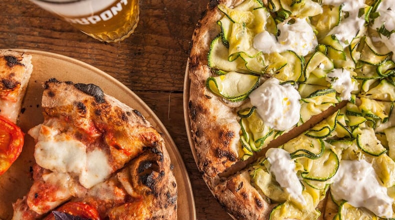 An undated handout photo of sourdough pizza and fresh-baked bread from a giant oven at De Superette. At De Superette, the chef Kobe Desramaults centers his convivial restaurant on the oven built for bread.