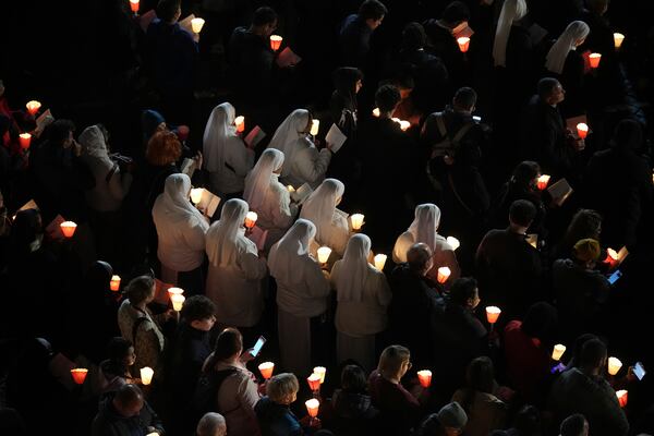 Nuns attend the procession outside the Colosseum during the Via Crucis (Latin for 'way of the cross') in Rome, Friday, April 18, 2025. (AP Photo/Andrew Medichini)