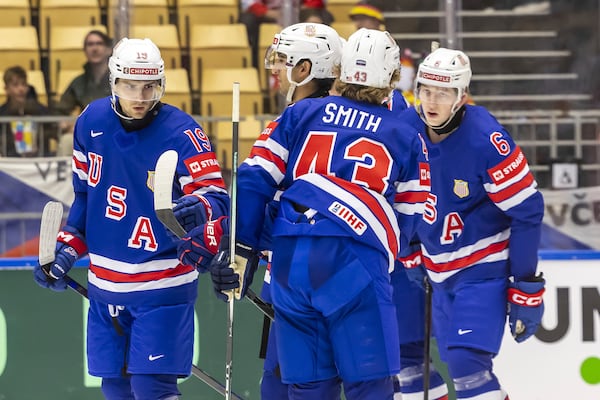 USA's forward Cutter Gauthier, left, celebrates his goal with his teammates, during the IIHF 2025 World Championship preliminary round group B game between USA and Hungary, at the Jyske Bank Boxen, in Herning, Denmark, Sunday, May 11, 2025. (Salvatore Di Nolfi/Keystone via AP)