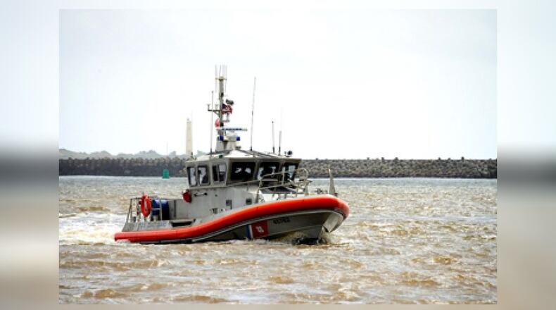 A medium-sized, 45-foot response boat like this one helped to pull two people from the water near Brunswick after their boat capsized Monday.