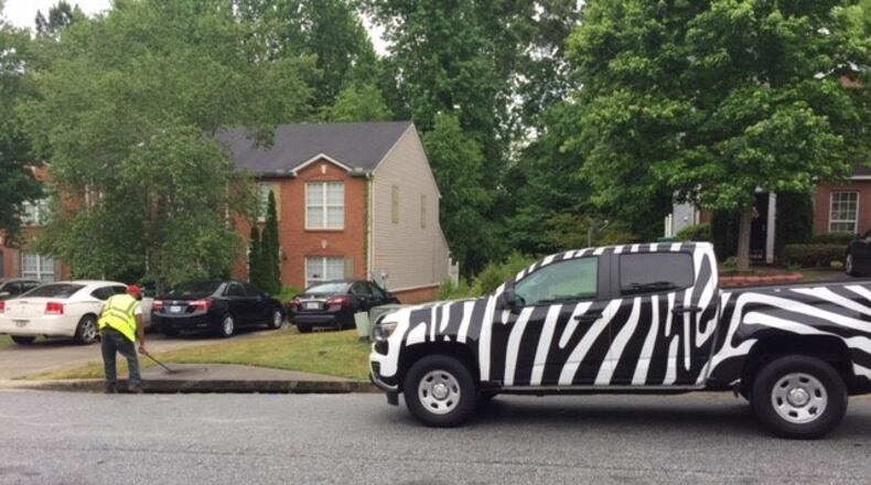 East Point hired Lowe Engineers to inventory the storm water conveyance system. City officials urge residents not to be alarmed when they see the zebra-striped trucks, a trademark of the company, in the area. CONTRIBUTED