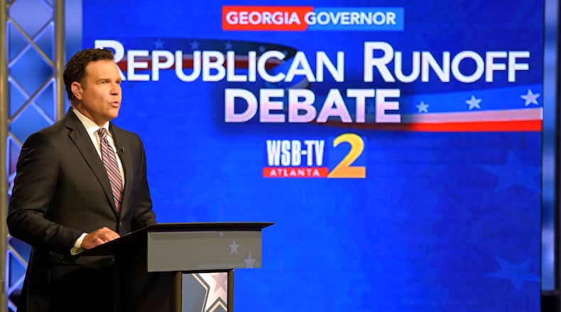 Justin Farmer in 2018 moderating a debate between Republican candidates for governor, Lt. Gov. Casey Cagle and Secretary of State Brian Kemp. Jenna Eason / Jenna.Eason@coxinc.com