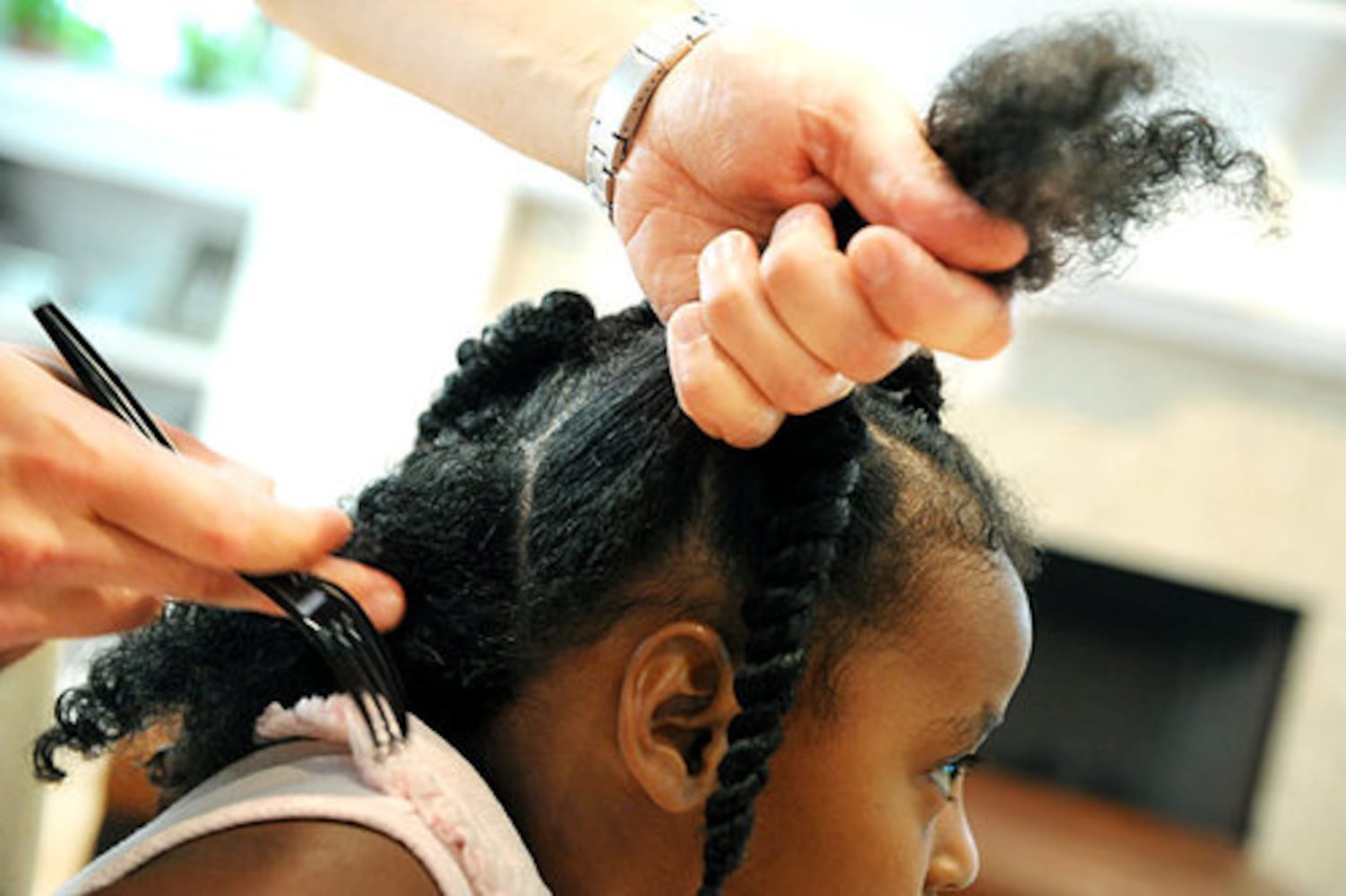 Braiding daughter's hair a labor of love