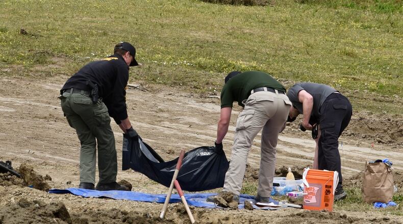 Investigators from the Humboldt County Sheriff's Office search the grounds of Miranda's Rescue Animal Sanctuary in Fortuna, Calif., June 24, 2026, where the remains of at least 117 dogs were found. (Ryan Burns/Lost Coast Outpost via P)