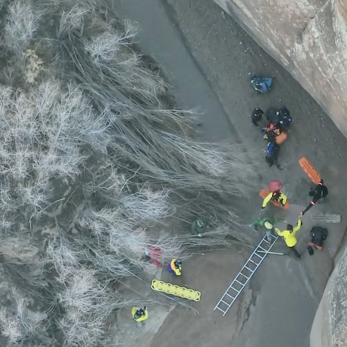 This image taken from drone footage provided by Grand County Search and Rescue shows a man being freed from quicksand Sunday, Dec. 7, 2025, in Arches National Park in eastern Utah.