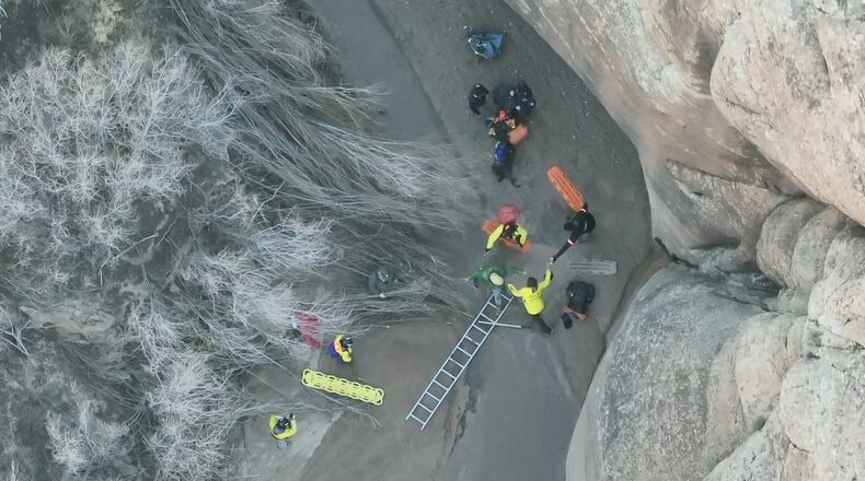 This image taken from drone footage provided by Grand County Search and Rescue shows a man being freed from quicksand Sunday, Dec. 7, 2025, in Arches National Park in eastern Utah.