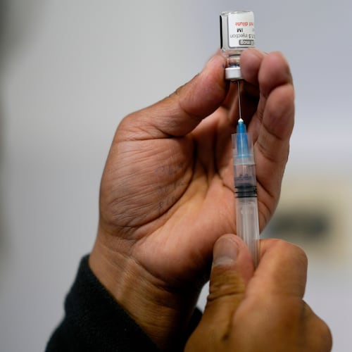 FILE - A healthcare worker prepares a shot of the Pfizer COVID-19 vaccine in La Paz, Bolivia, Jan. 7, 2025. (AP Photo/Juan Karita, File)