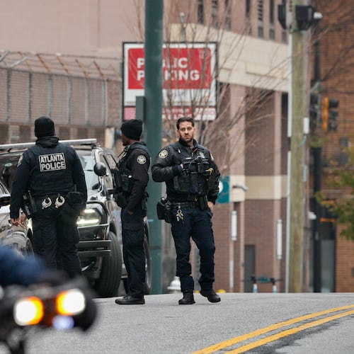 Atlanta police officers assist with the search for Rockdale County escaped inmate Timothy Shane. He is accused of running away from Grady Memorial Hospital on Dec. 1, 2025. (Ben Hendren for The Atlanta Journal-Constitution)