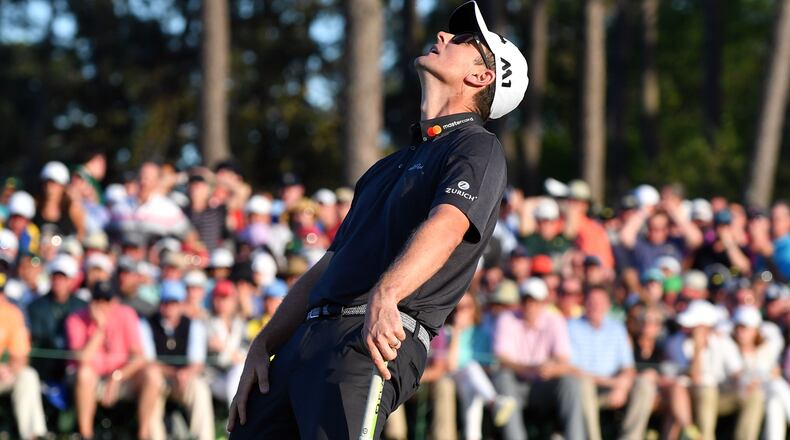 Justin Rose reacts to missing a putt on the 18th hole. He and Sergio Garcia would both finish at 9-under, forcing a one-hole playoff. Play begins in the final round of the 81st Masters tournament at the Augusta National Golf Club, Sunday, April 9, 2017. BRANT SANDERLIN / SPECIAL