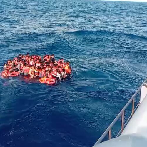 In this photo made from video released by the Indonesian National Search and Rescue Agency (BASARNAS), crew pull survivors from a passenger ferry Putri Yasmin that caught fire while traveling from the tourist island of Bali to neighboring island of Lombok toward a rescue ship in the waters of Lombok Strait, Indonesia, Wednesday, Aug. 12, 2026. (BASARNAS via AP)