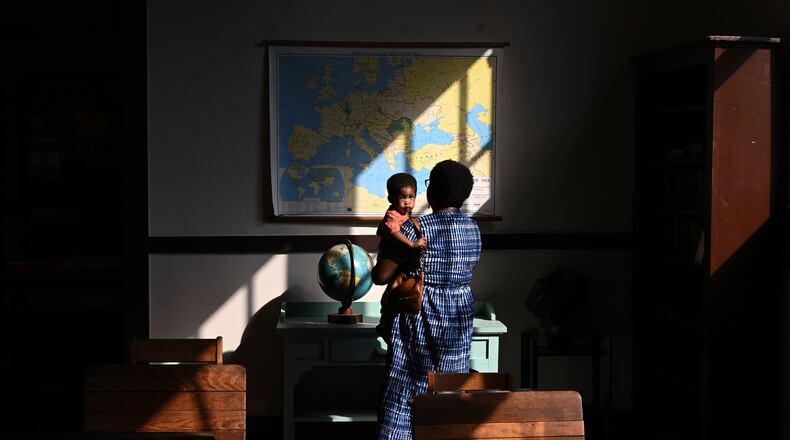 Visitors to the schoolroom display at the Jimmy Carter National Historical Park's visitor center, which is housed in the former Plains High School. (Washington Post photo by Matt McClain)