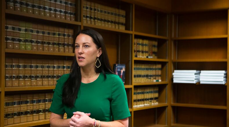 Prosecutor Cara Convery talks a reporter on Friday, August 5, 2022, in the State Law Building in Atlanta. Convery, the AG's gang unit section chief, discussed how she plans to tackle gangs in the state. CHRISTINA MATACOTTA FOR THE ATLANTA JOURNAL-CONSTITUTION