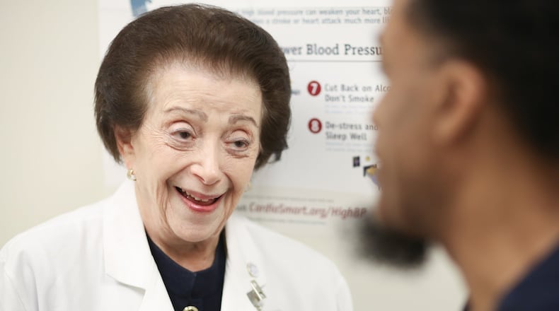 Dr. Nanette Wenger, a cardiologist, talks with patient Michael Daniels at Grady Hospital Wednesday. PHOTO / JASON GETZ