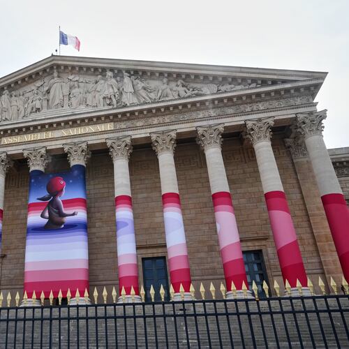 The French National Assembly is draped with the artwork "Marianne rêve" ("Marianne Dreams") by French street artist Seth, depicting Marianne the symbol of the French Republic, before lawmakers vote later on final approval of a bill allowing adults with incurable illnesses to receive lethal medication, in Paris, Wednesday, July 15, 2026. (AP Photo/Michel Euler)
